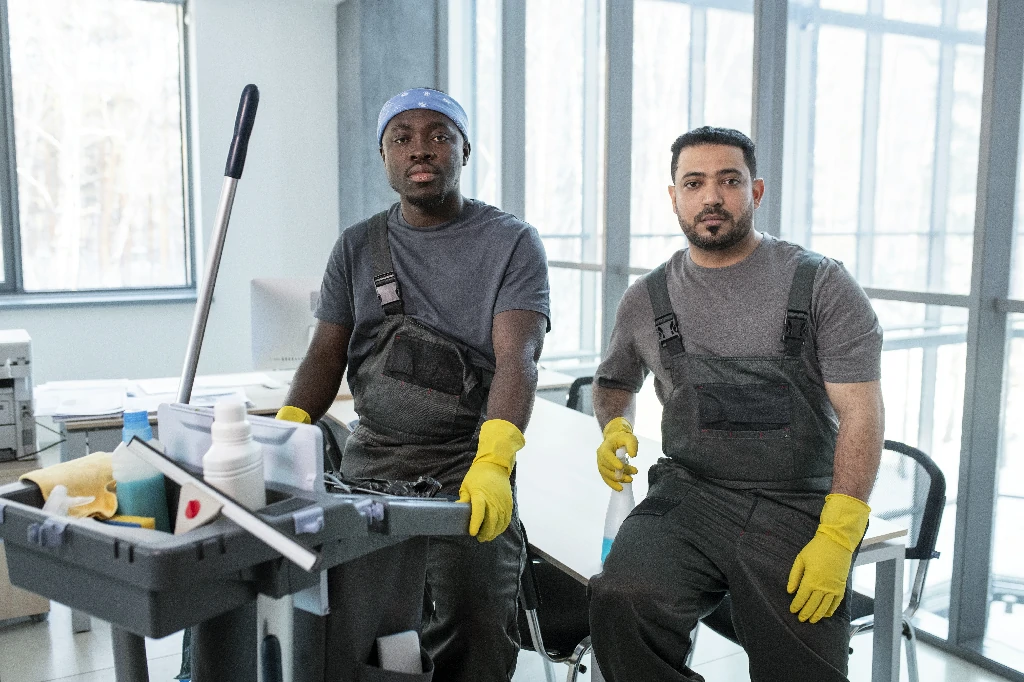 medium-shot-workers-with-cleaning-cart~1